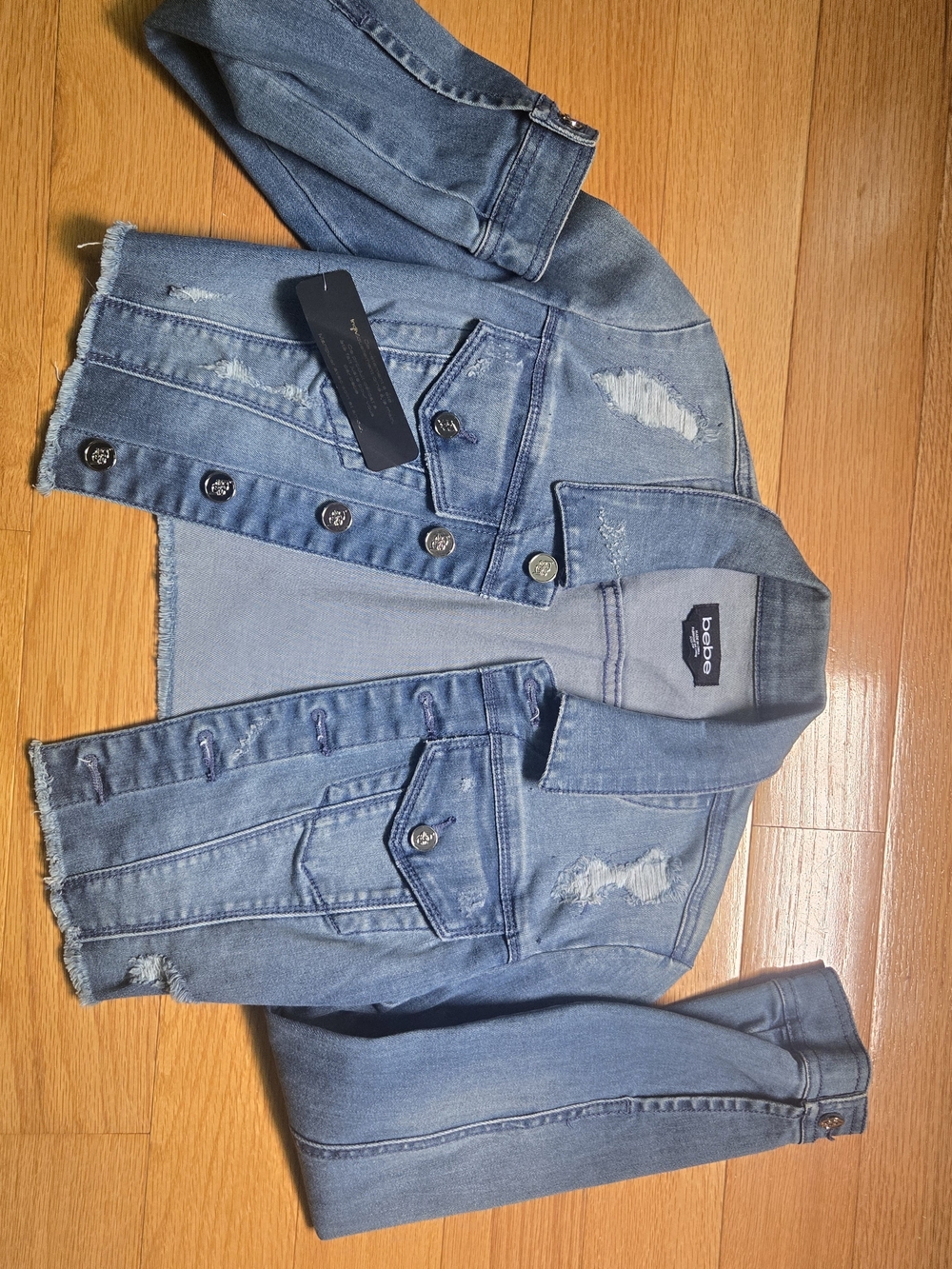bebe Light Blue Distressed Denim Jacket with Raw Hem